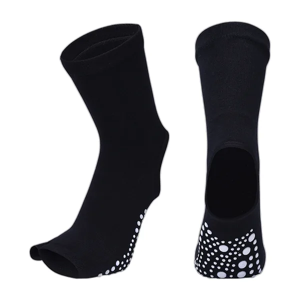 Paire de chaussettes de yoga noires à picots blancs