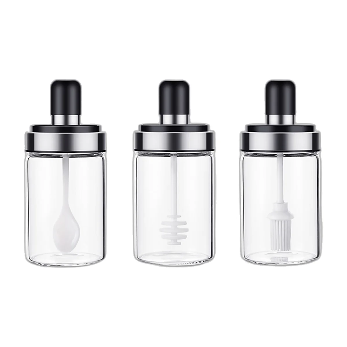 Trois pots en verre à couvercle noir : cuillère, cuillère à miel et pinceau