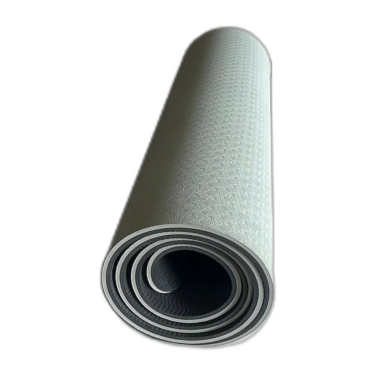 Tapis de yoga TPE gris et noir roulé, face texturée visible